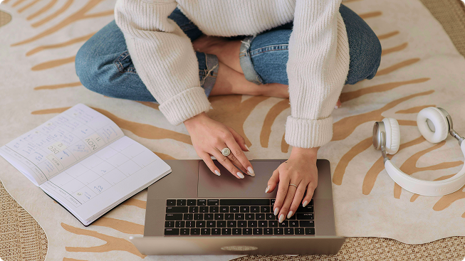 Woman on computer with notebook