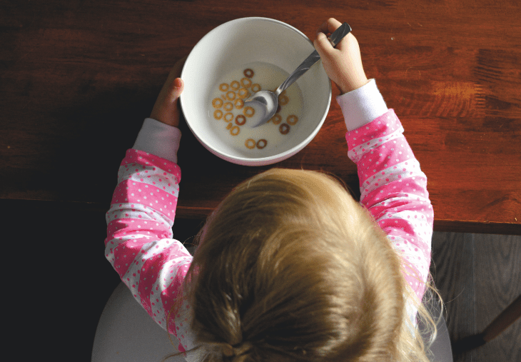 Child eating healthy cereal