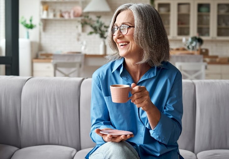 Older white woman drinking tea