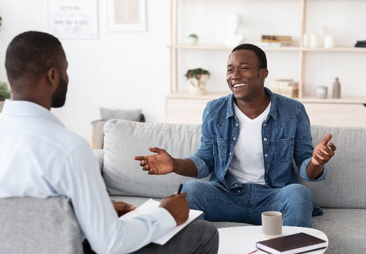 African American man making progress with his therapist